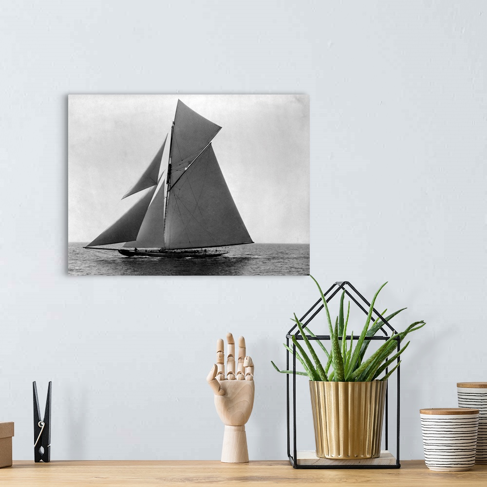 A bohemian room featuring The fully rigged sloop Shamrock sails in the Atlantic off New England.