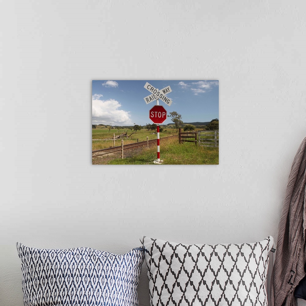 A bohemian room featuring A railway crossing and stop sign in farmland west of Auckland on a summer afternoon.