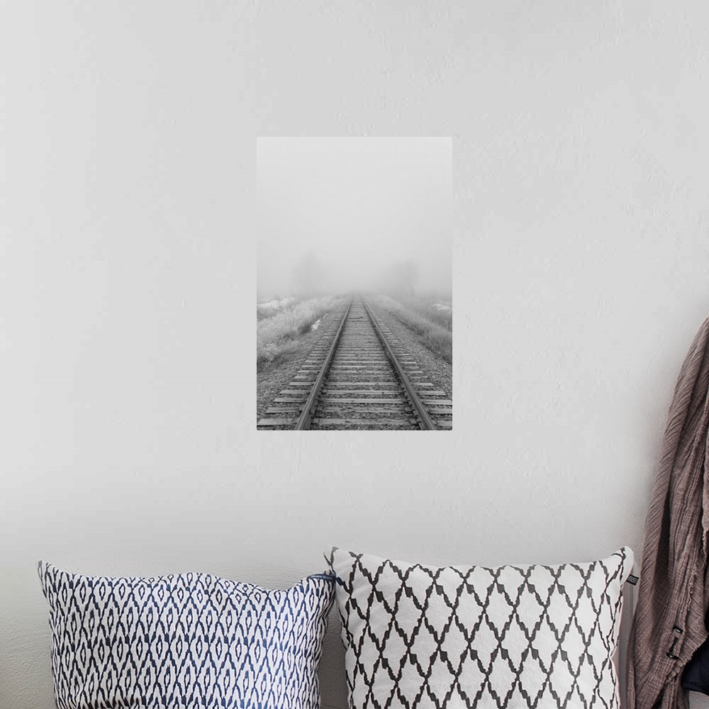 A bohemian room featuring Railroad tracks fade into the morning fog