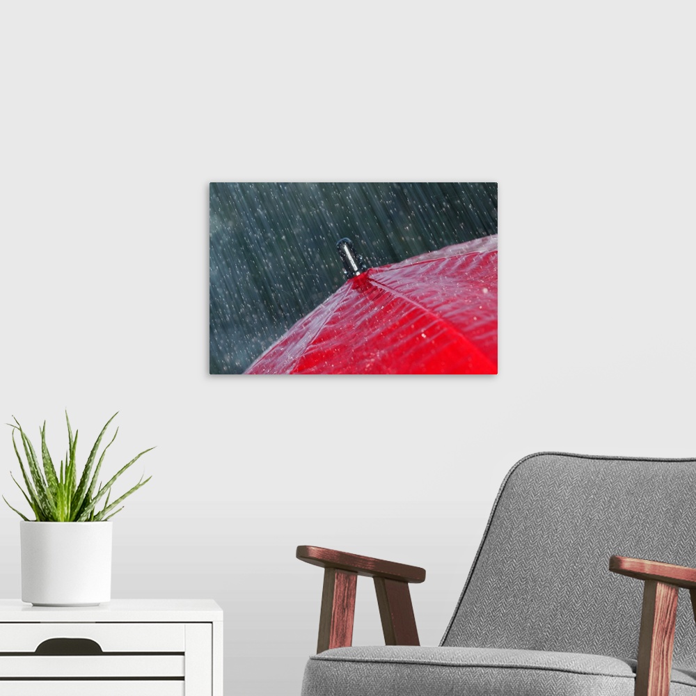 A modern room featuring Rain falling on umbrella