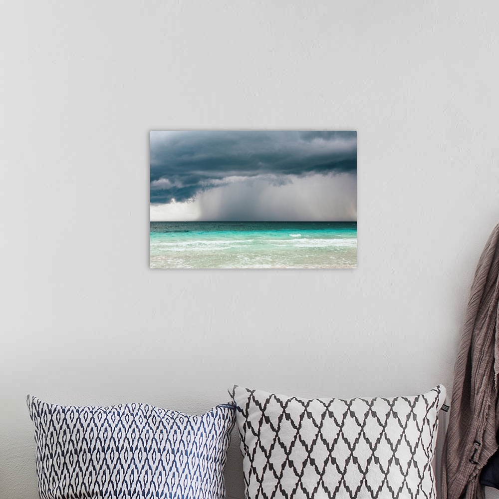 A bohemian room featuring Rain storm over the ocean and beach