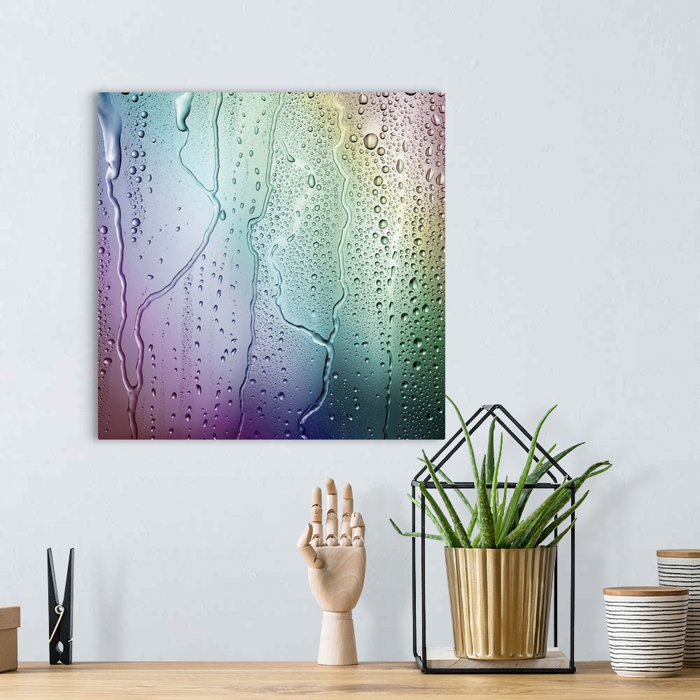 A bohemian room featuring Droplets of condensation form an irregular pattern against a multicolored rainbow background