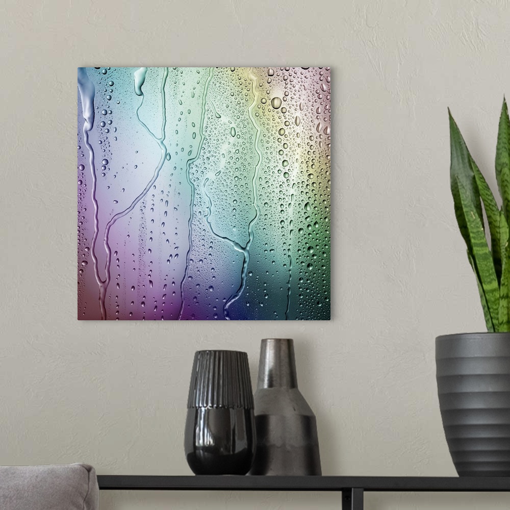 A modern room featuring Droplets of condensation form an irregular pattern against a multicolored rainbow background
