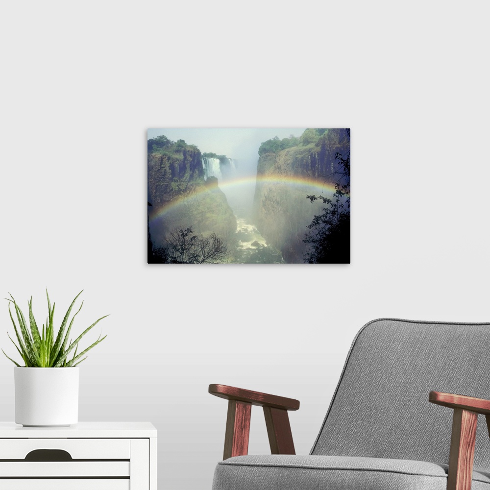 A modern room featuring Rainbow over misty river canyon