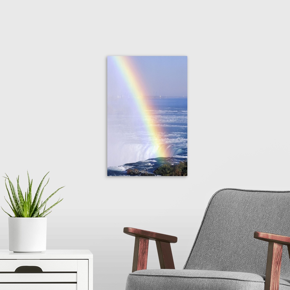 A modern room featuring 'Rainbow Over Niagara Falls, New York'