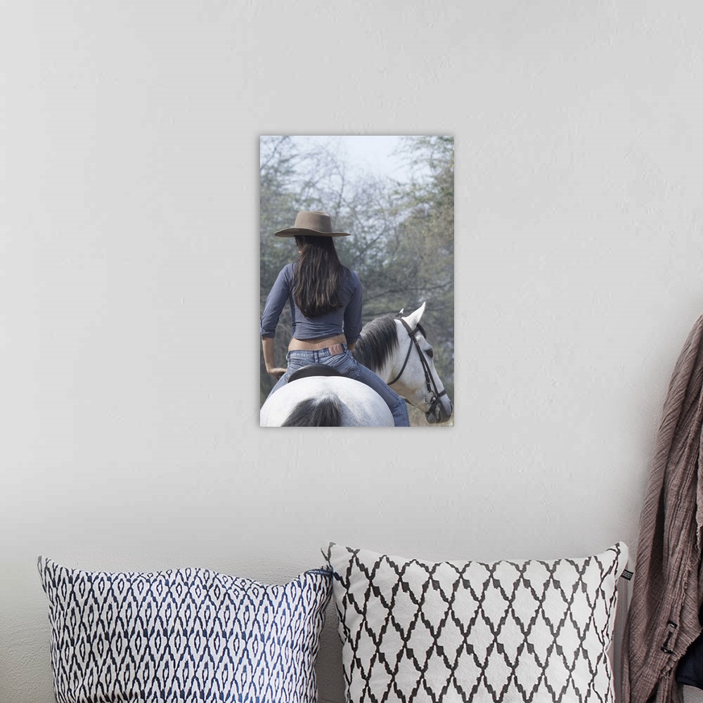 A bohemian room featuring Rear View Of A Woman Riding A Horse