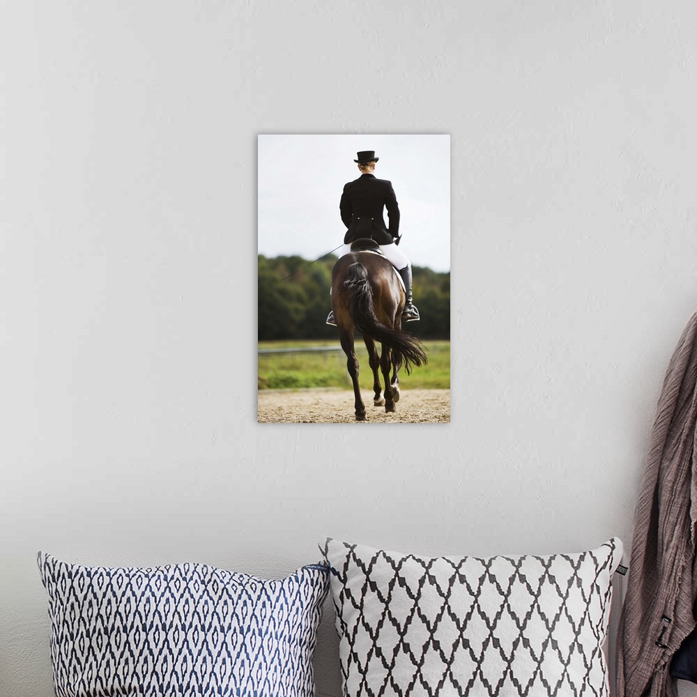 A bohemian room featuring Rear view of female dressage rider exercising