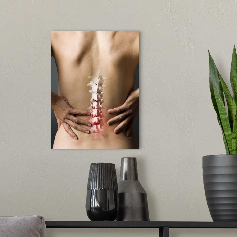 A modern room featuring Rear view of woman with hands on back and sore spine