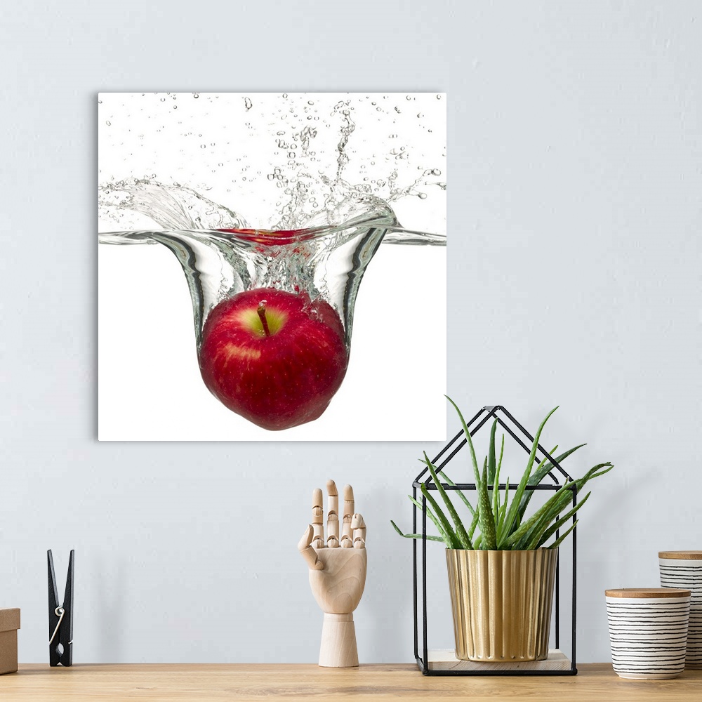 A bohemian room featuring Red apple splashing in water