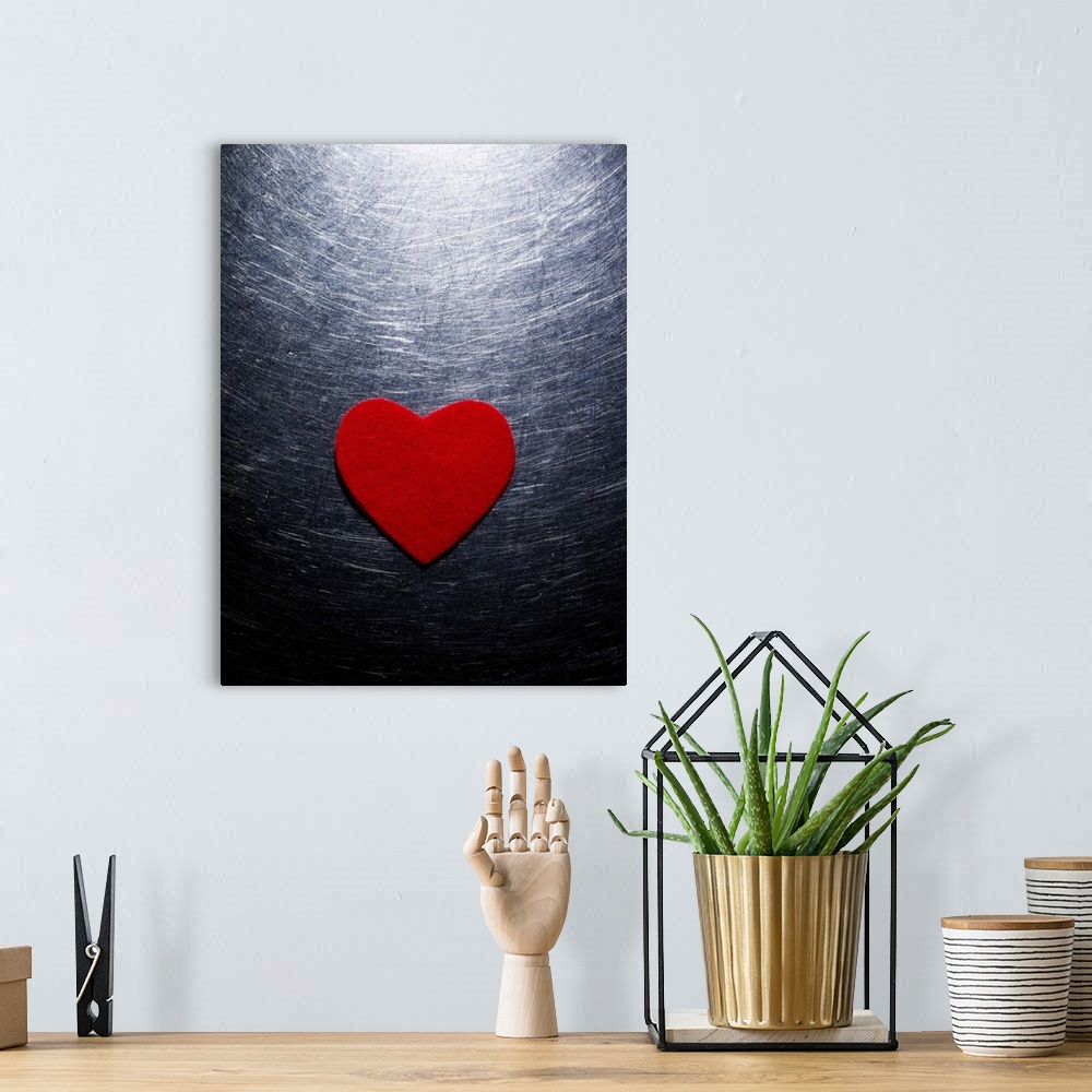 A bohemian room featuring Red Felt Heart on Stainless Steel Background.