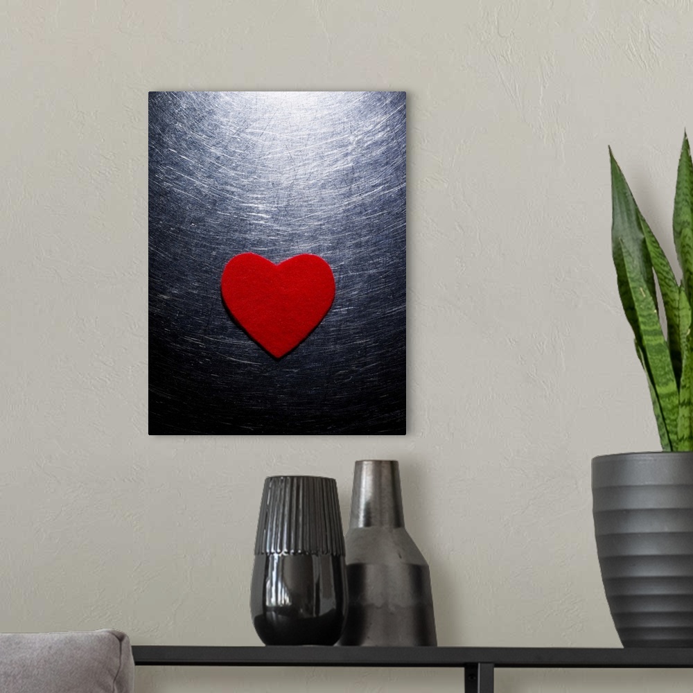 A modern room featuring Red Felt Heart on Stainless Steel Background.