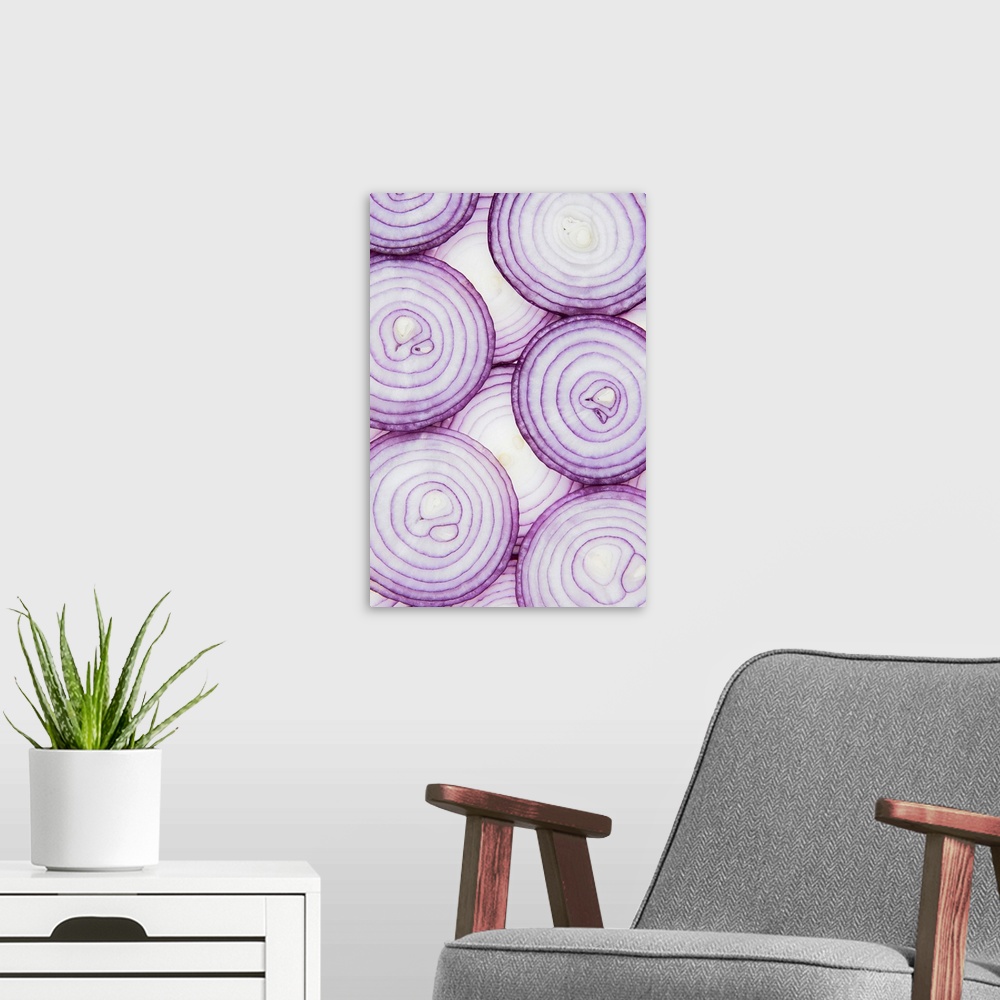 A modern room featuring Full frame of sliced red onion, on white background