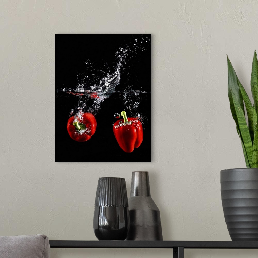 A modern room featuring red pepper splashing in water