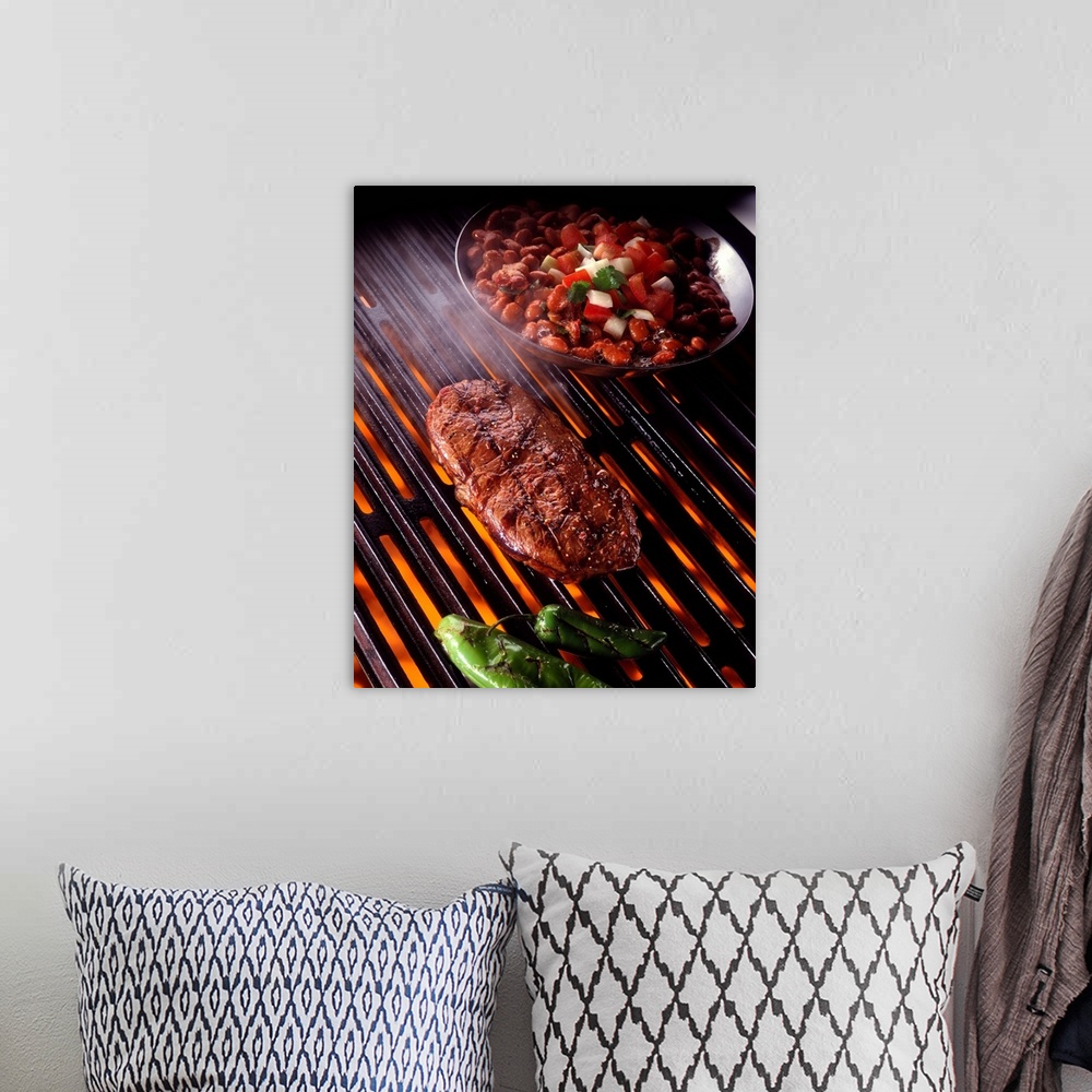 A bohemian room featuring Rib eye steak on grill with beans