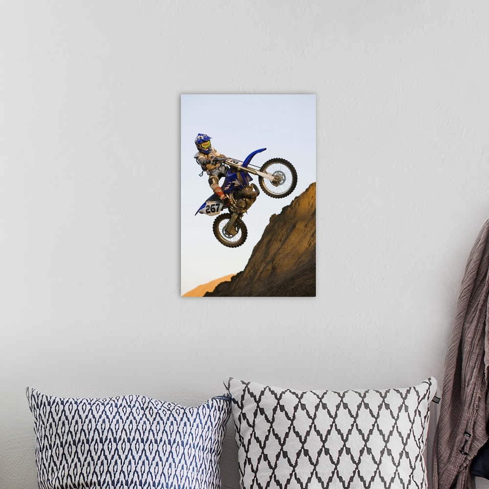 A bohemian room featuring Rider jumping dirt bike