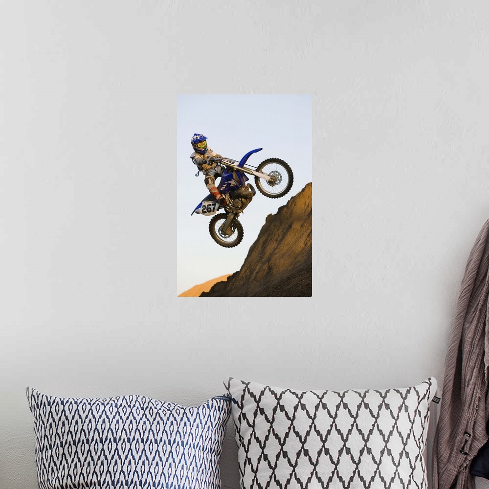 A bohemian room featuring Rider jumping dirt bike