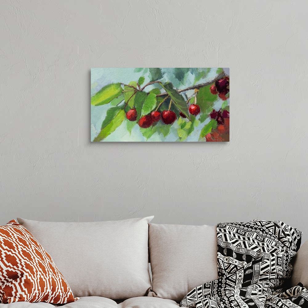 A bohemian room featuring Bright scarlet cherries on a branch.