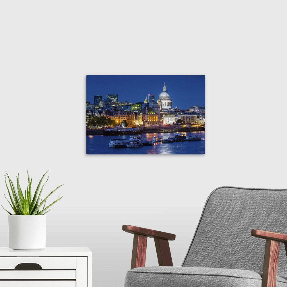 A modern room featuring River Thames and St Paul's Cathedral at dusk