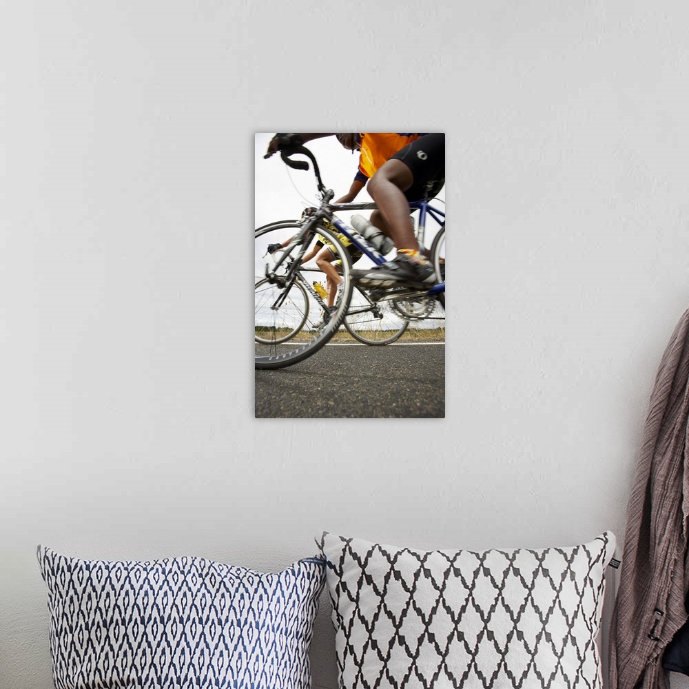 A bohemian room featuring Road cyclists in action, side view (surface level)