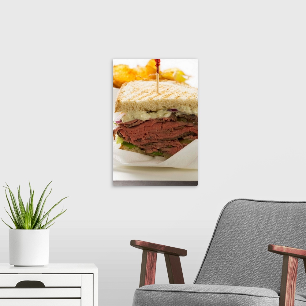 A modern room featuring Roast beef sandwich with crisps
