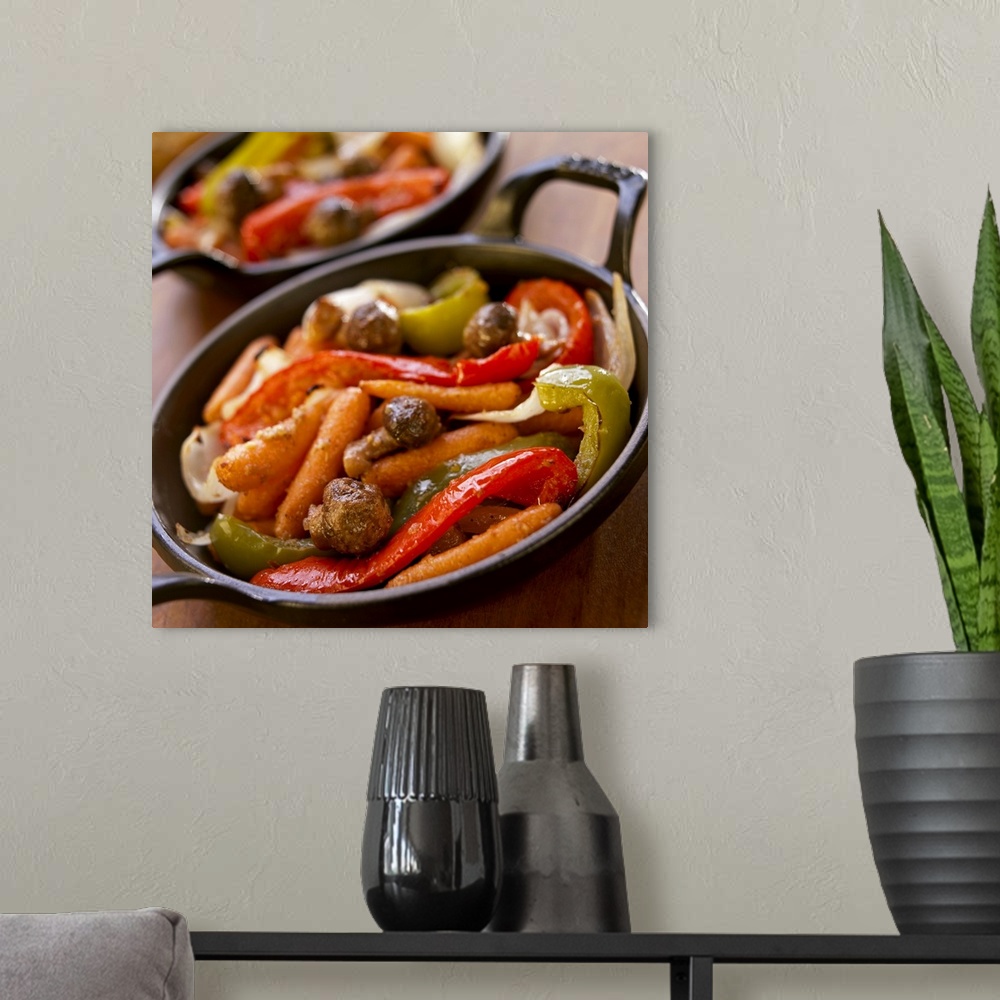 A modern room featuring Roasted vegetables in skillet, close-up