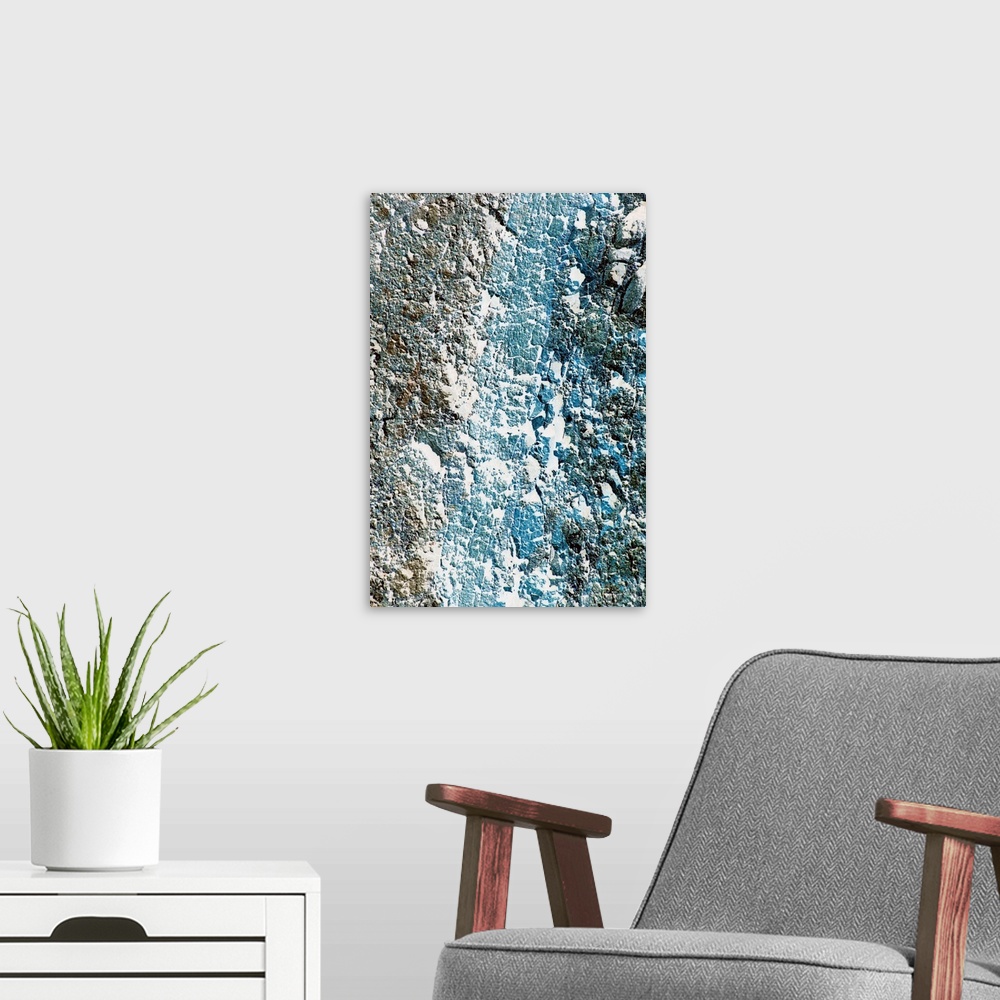 A modern room featuring Tall printed canvas of the up close of a rock wall.