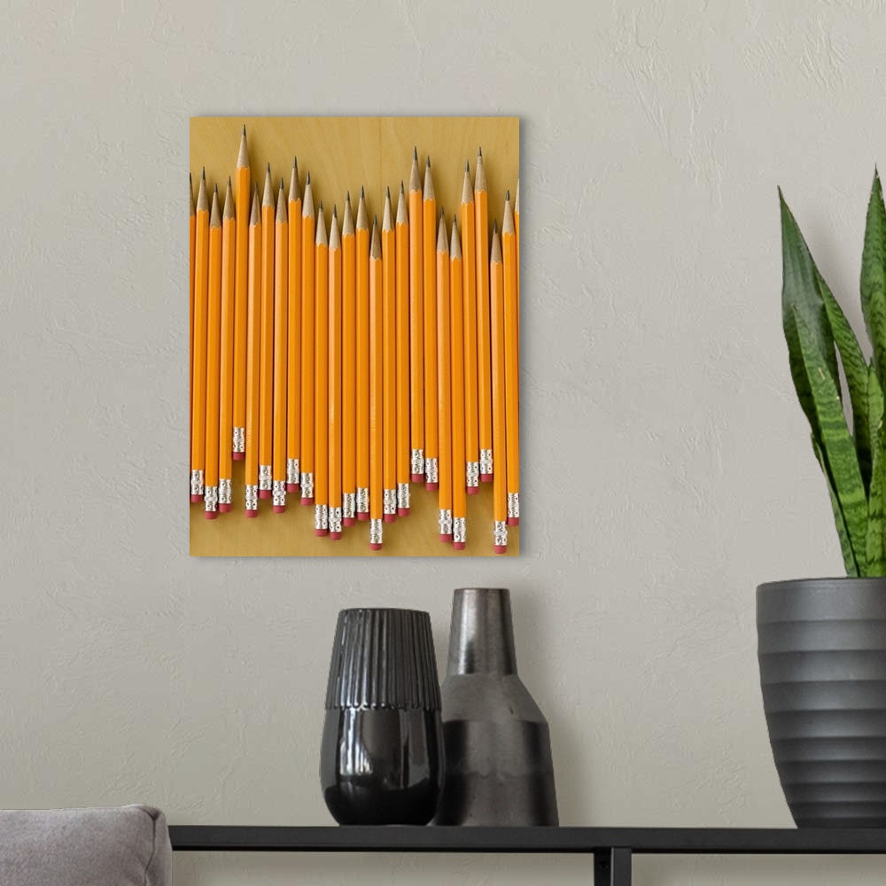 A modern room featuring Row of pencils on table