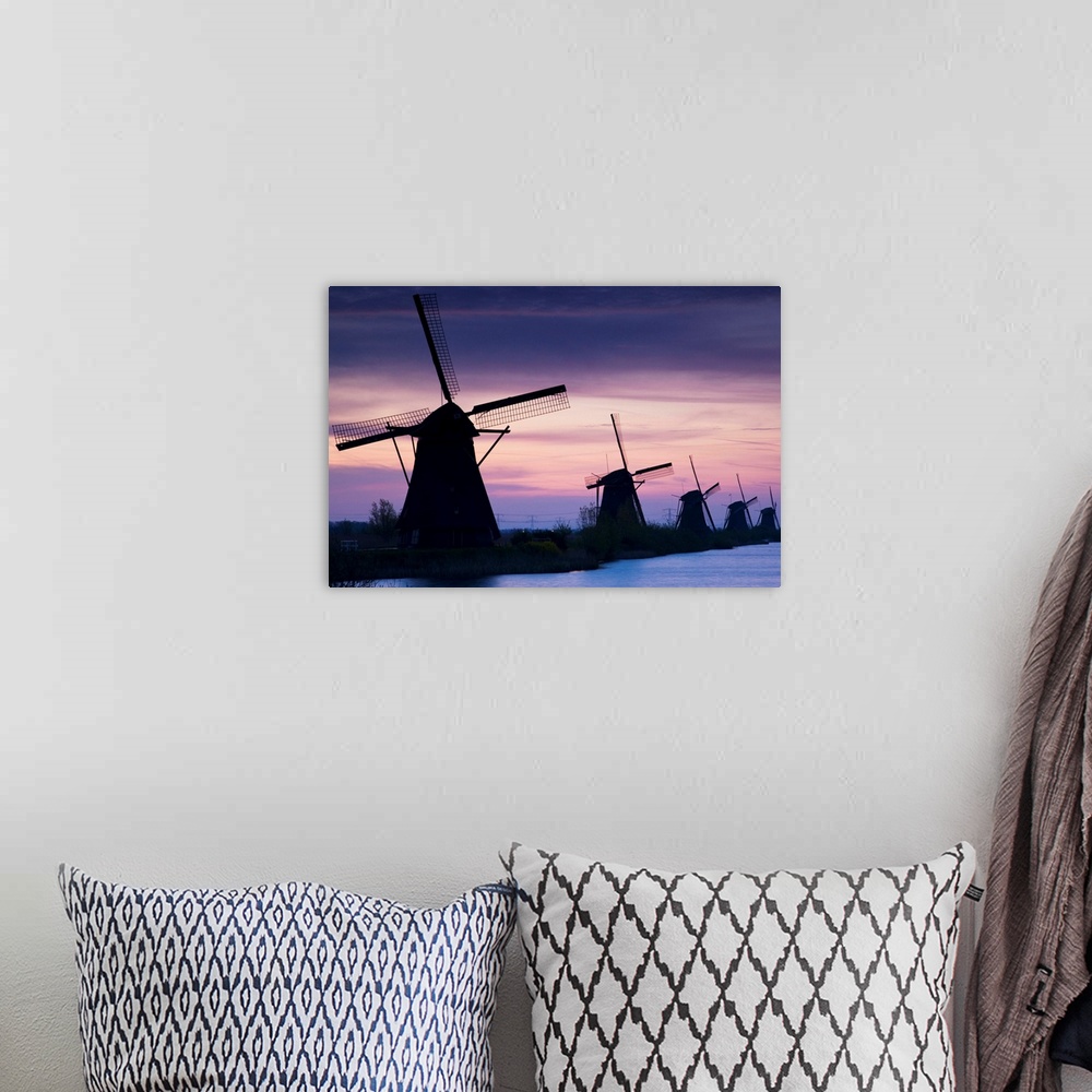 A bohemian room featuring Row Of Windmills At Sunrise In The Netherlands