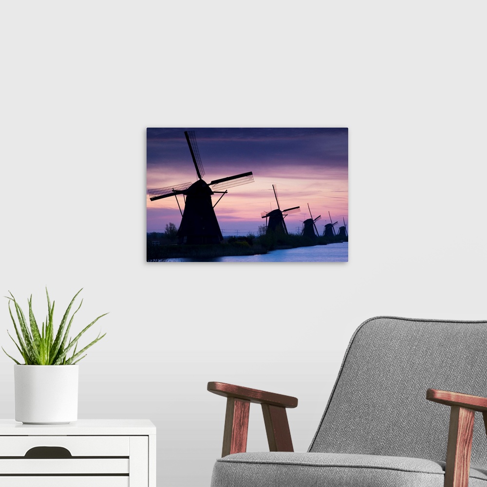 A modern room featuring Row Of Windmills At Sunrise In The Netherlands