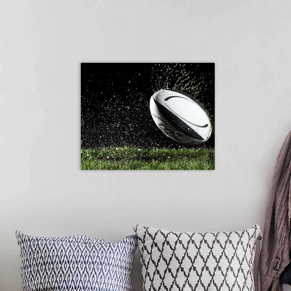 A bohemian room featuring Rugby ball in motion over grass
