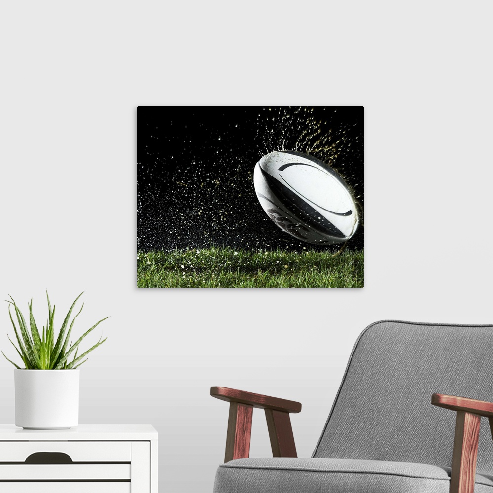 A modern room featuring Rugby ball in motion over grass