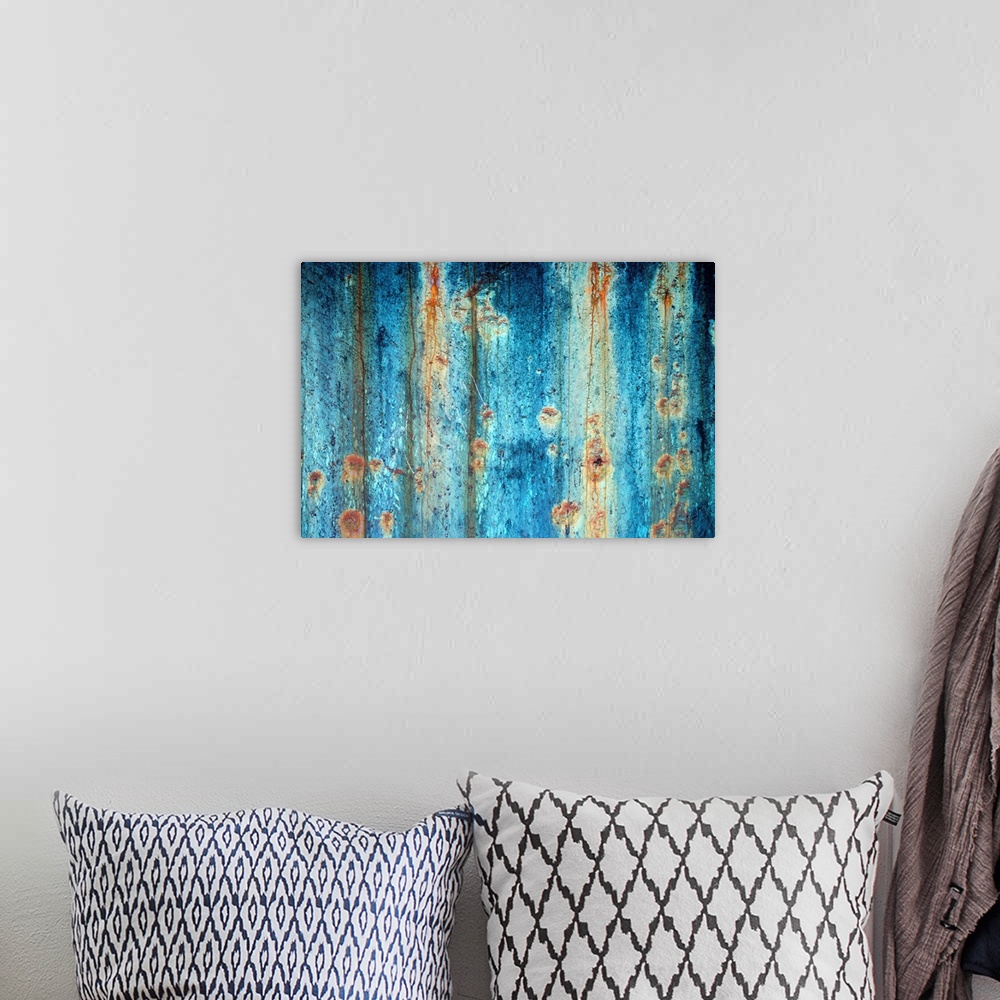 A bohemian room featuring Large photograph shows a rough textured surface that has been heavily affected by oxidation and c...
