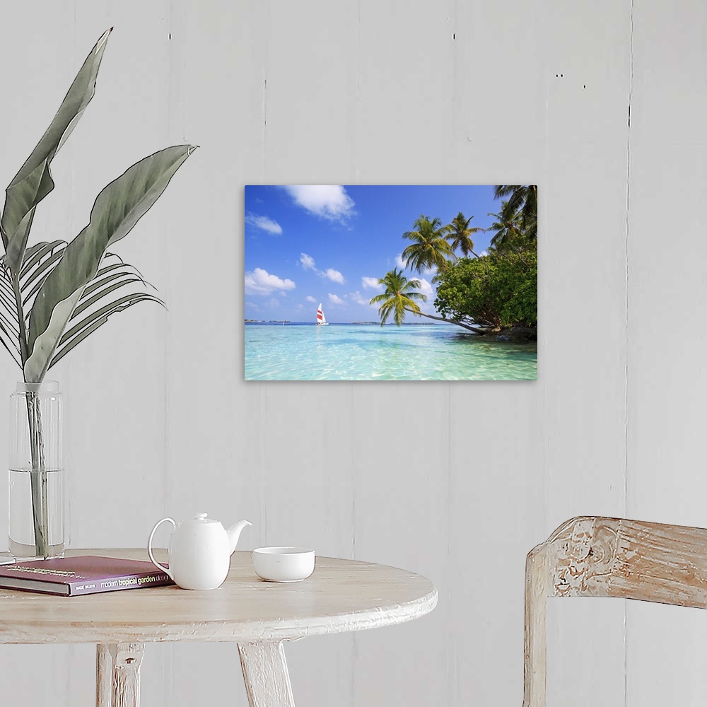 A farmhouse room featuring Big, landscape photograph of palm trees swaying over the clear blue waters of the Indian Ocean.  ...