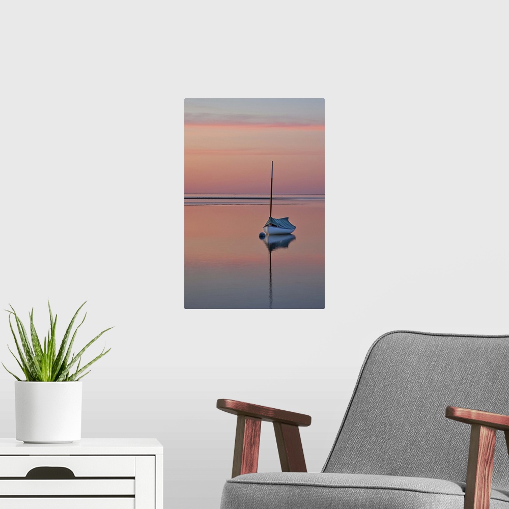 A modern room featuring Sailboat and buoy at sunset.