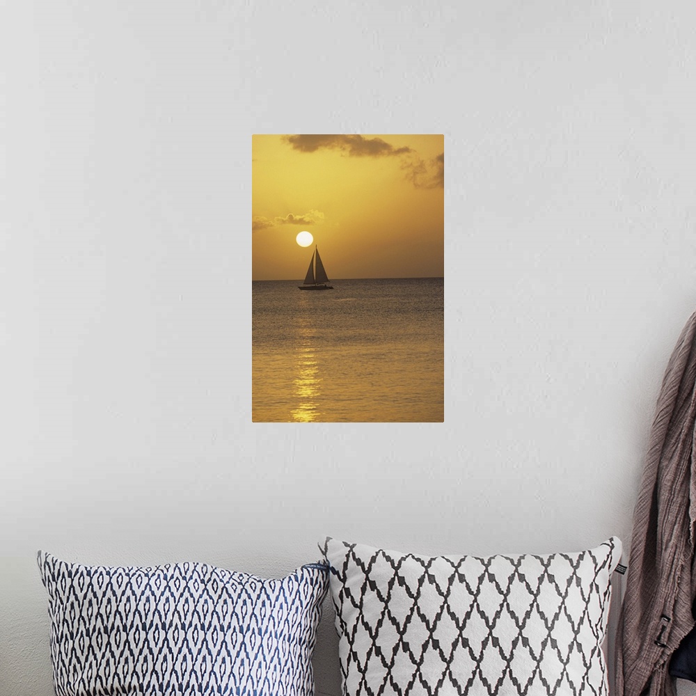 A bohemian room featuring Sailboat at sunset