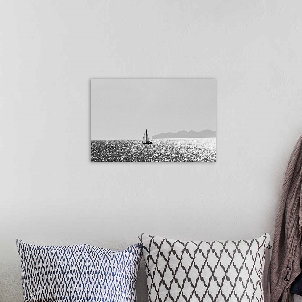 A bohemian room featuring Sailboat on shimmering water