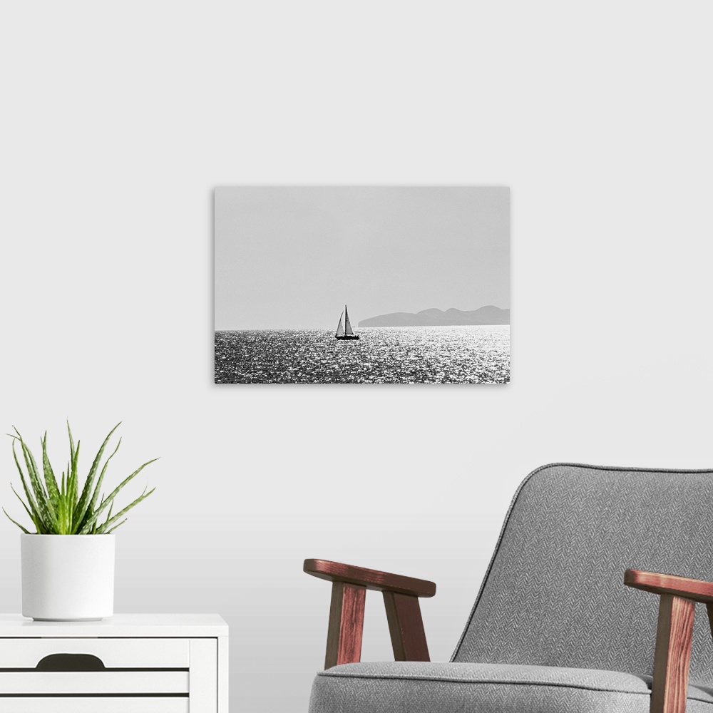 A modern room featuring Sailboat on shimmering water