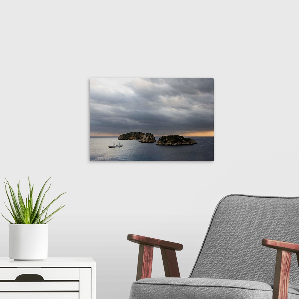 A modern room featuring Sailing boat near islands at sea