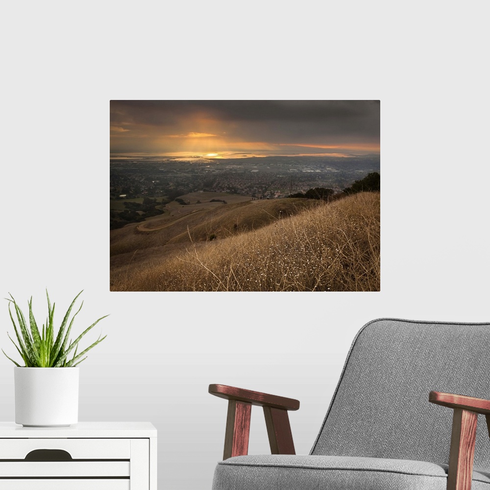 A modern room featuring San Francisco Bay under golden sunset from Mission Peak, Fremont, California.