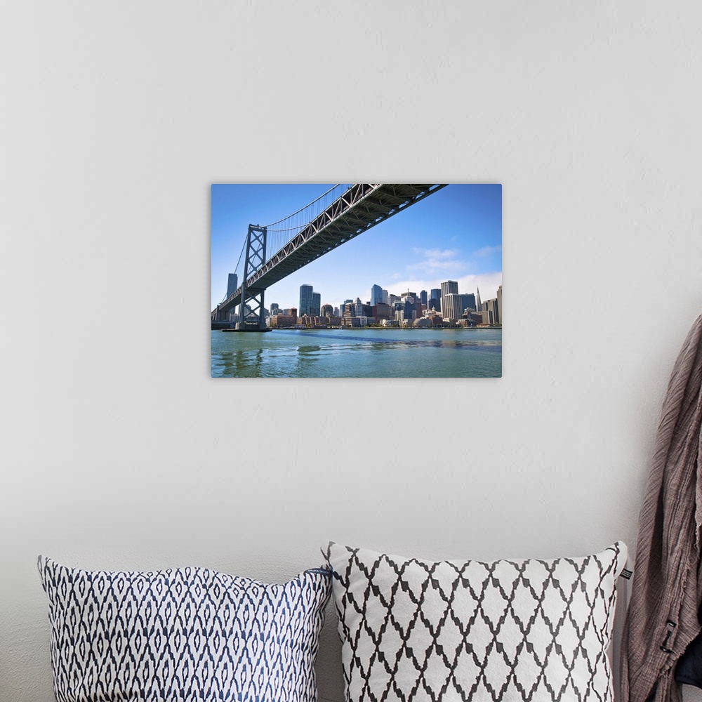 A bohemian room featuring San Franciscos Bay bridge as it connects with Embarcadero.