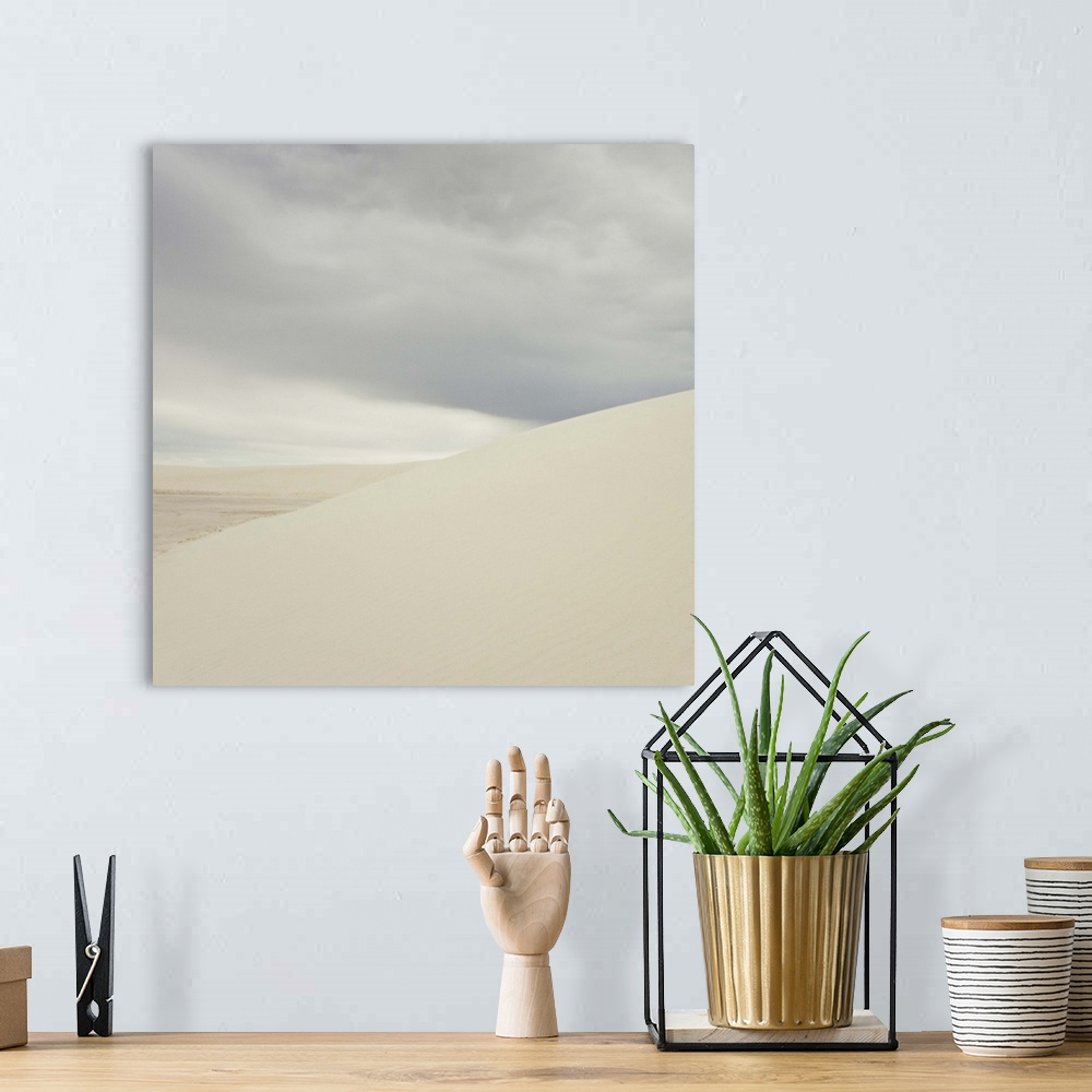A bohemian room featuring White sand dunes against cloudy sky.