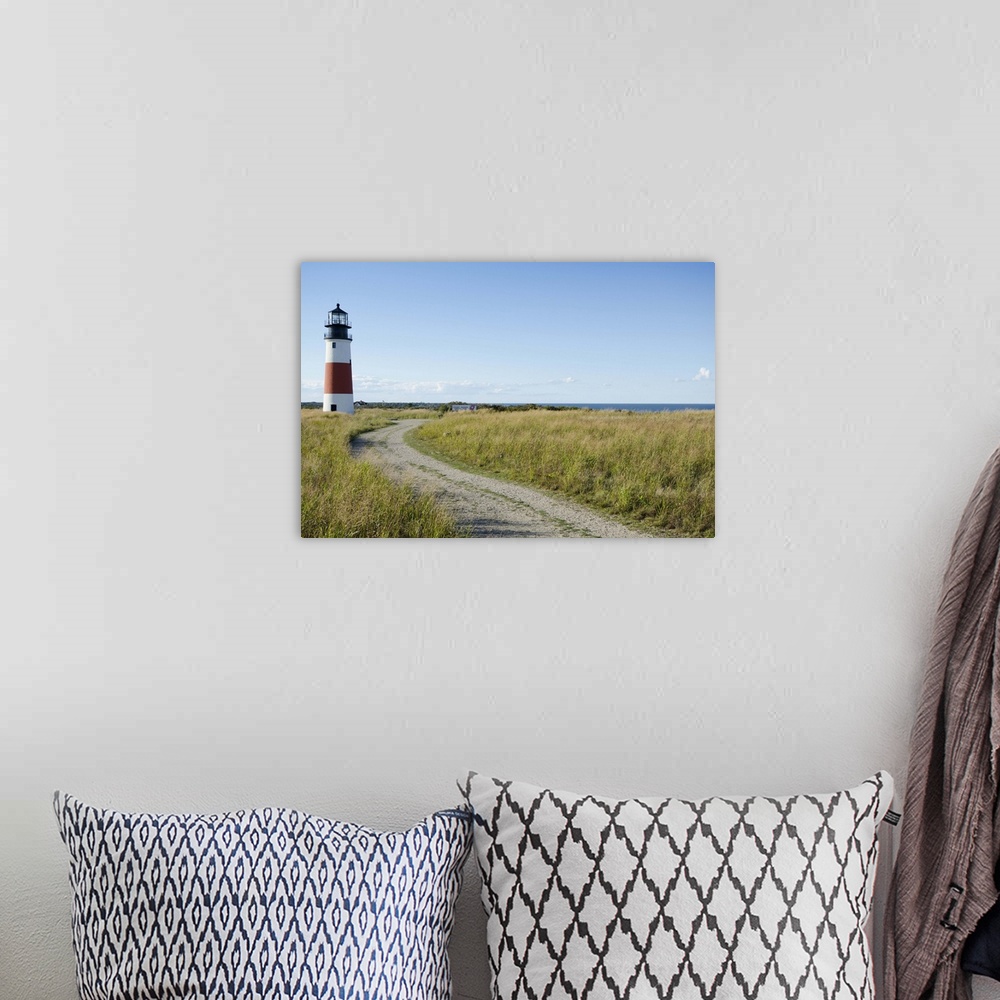A bohemian room featuring Sankaty Head Lighthouse and Atlantic Ocean, Nantucket Island, Massachusetts USA.