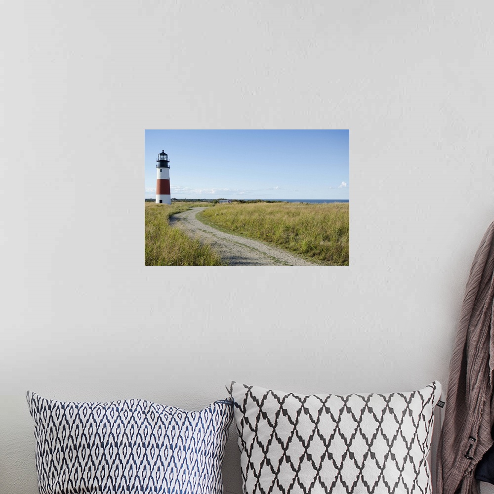 A bohemian room featuring Sankaty Head Lighthouse and Atlantic Ocean, Nantucket Island, Massachusetts USA.