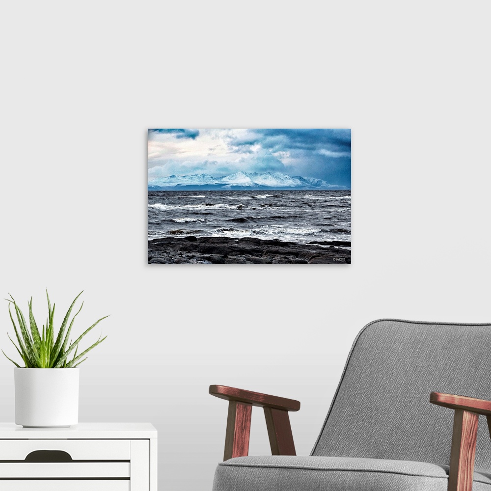 A modern room featuring Sea and mountain in winter.
