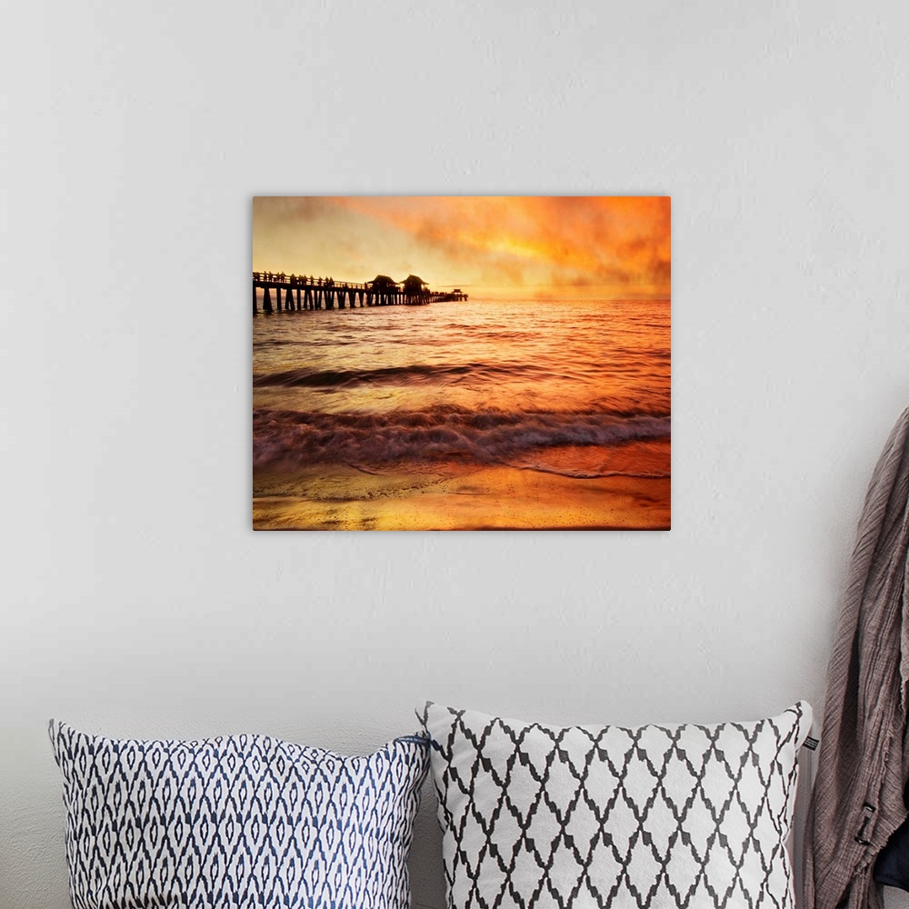 A bohemian room featuring Sunset with crowd of people walking on pier, sea fog rolling inmakes orange and gold mysterious a...