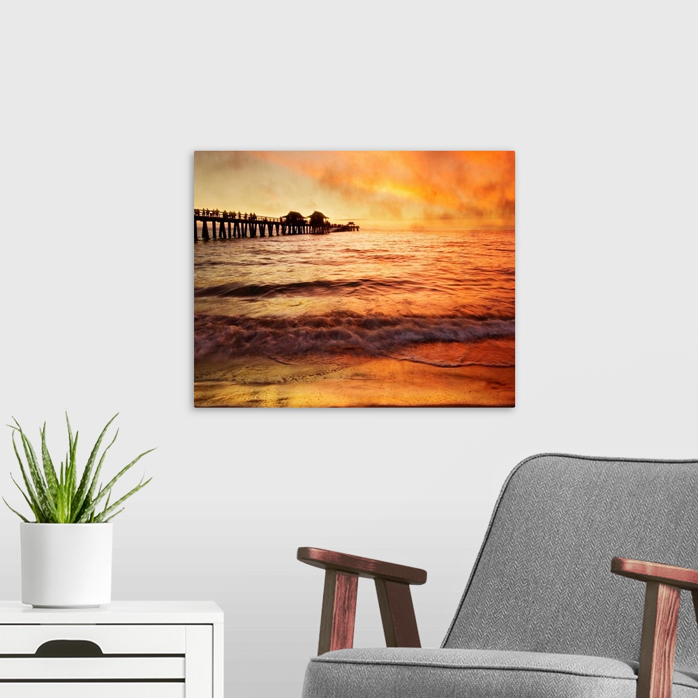 A modern room featuring Sunset with crowd of people walking on pier, sea fog rolling inmakes orange and gold mysterious a...