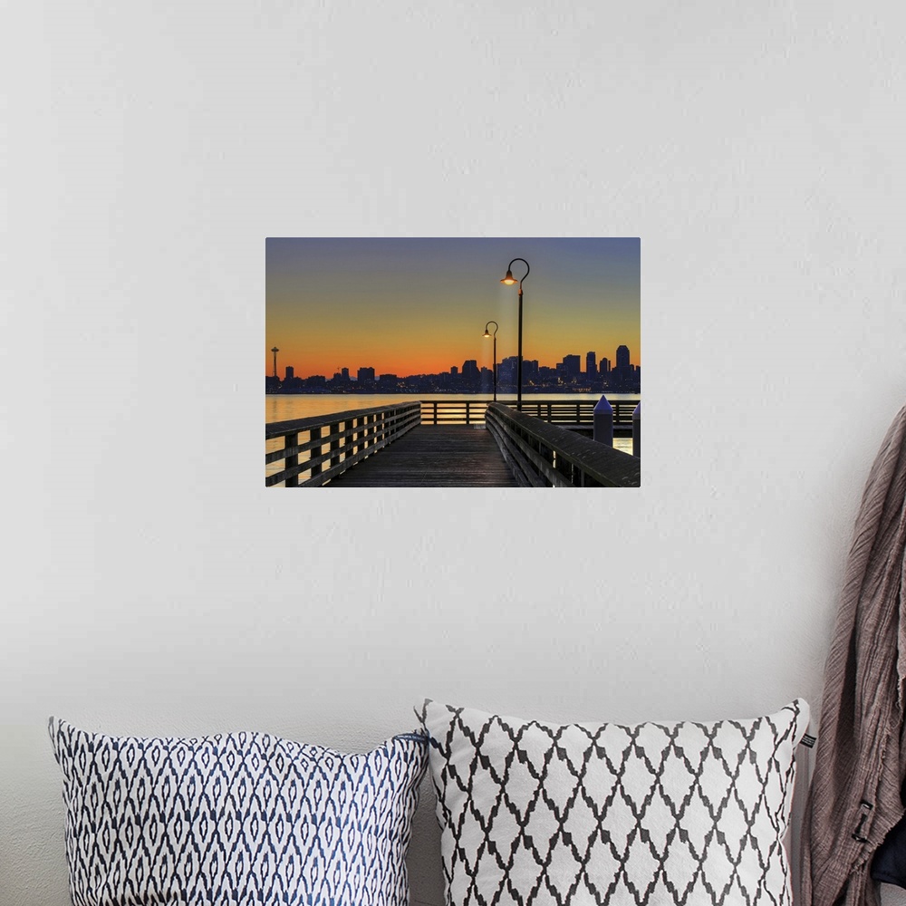 A bohemian room featuring Horizontal photograph on a giant wall hanging looking down the lit Seacrest Park Fishing Pier in ...