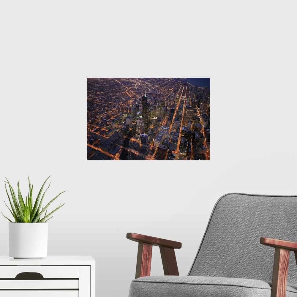 A modern room featuring Sears Tower and downtown from above during sunset in December with clear crisp skies. Right in th...