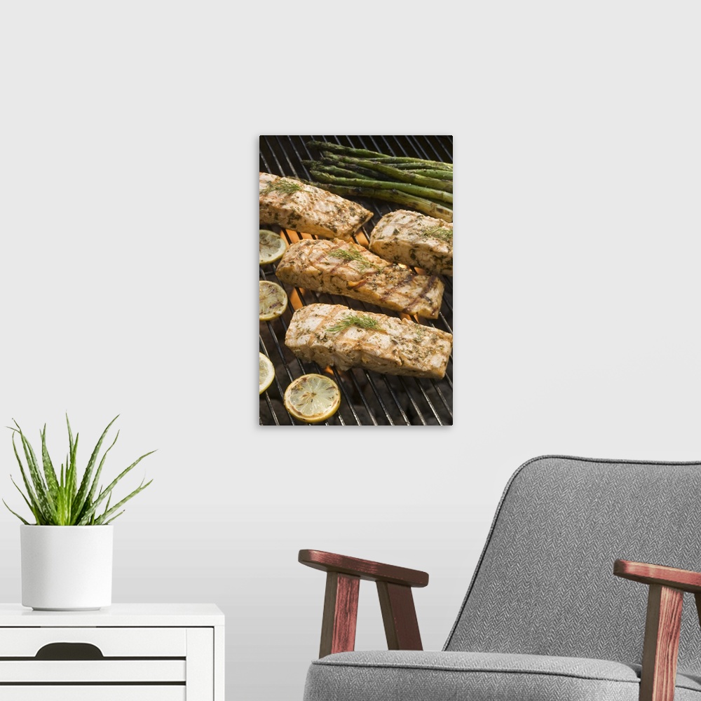 A modern room featuring Fish and asparagus cooking on grill