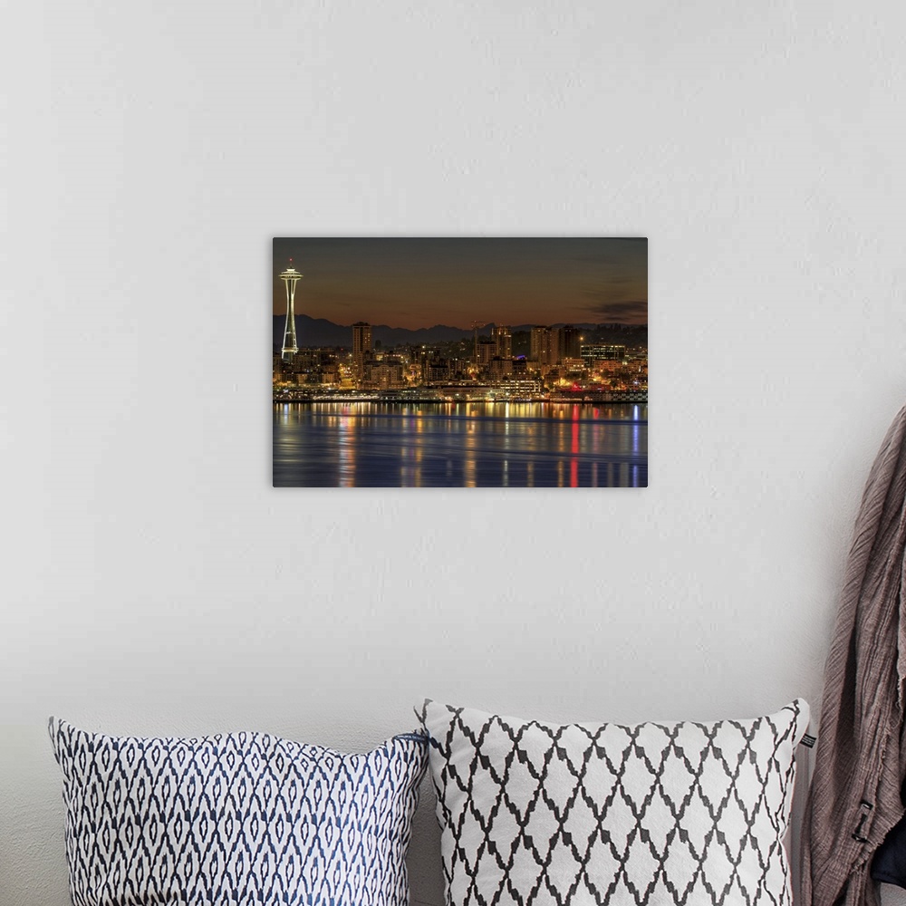 A bohemian room featuring Oversized, landscape photograph of a lit Seattle skyline, including the Space Needle, during earl...